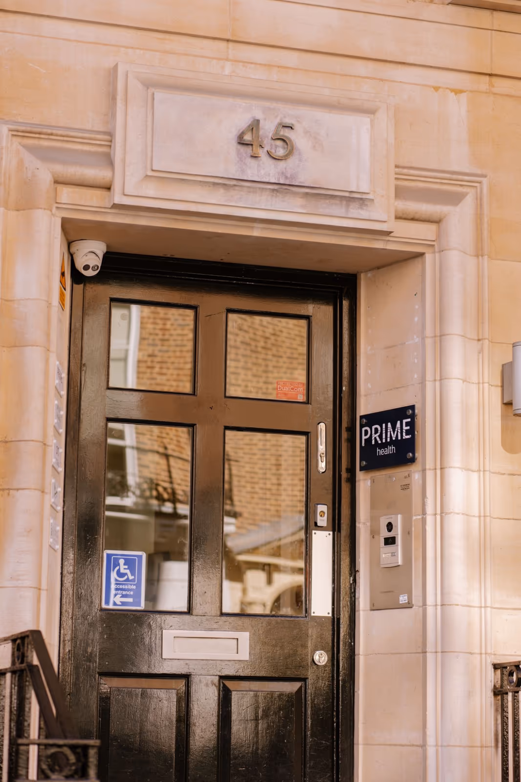 The entrance at 45 Queen Anne Street, with the Prime Health sign and the accessible entrance marked