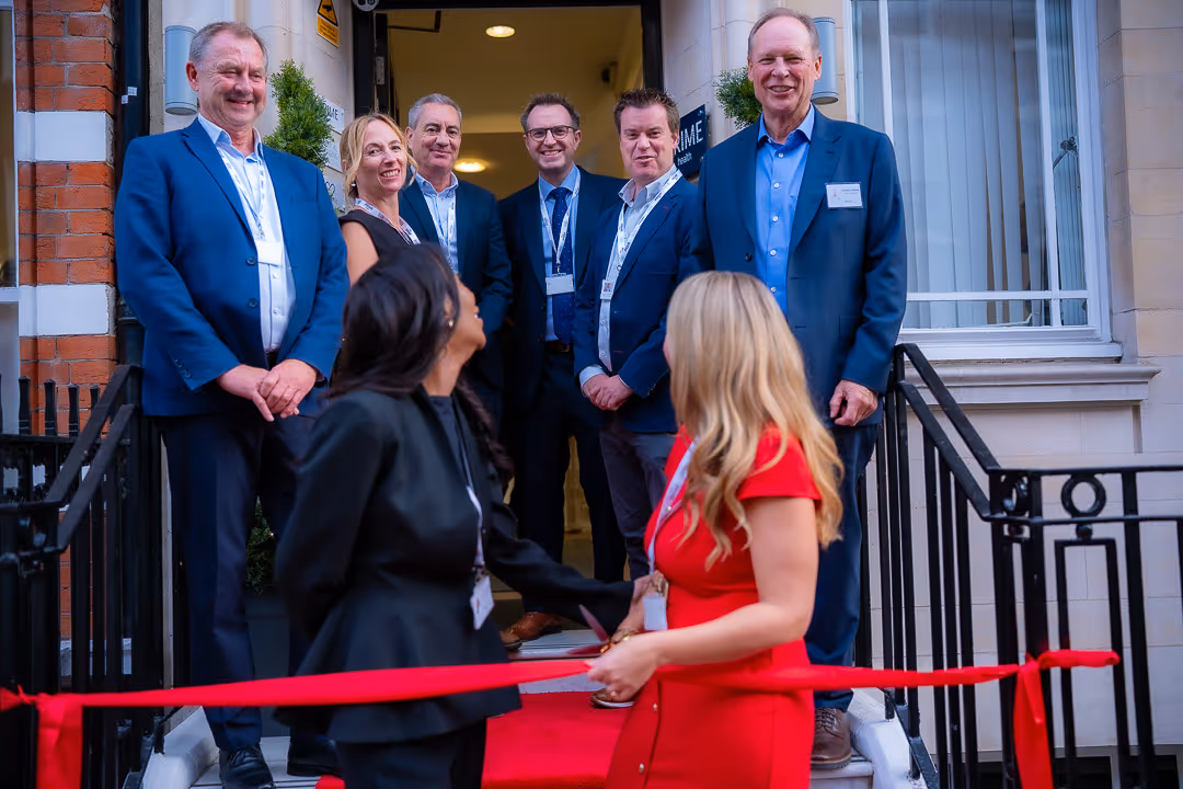 Cutting the ribbon on the steps of 45 Queen Anne Street at the relaunch