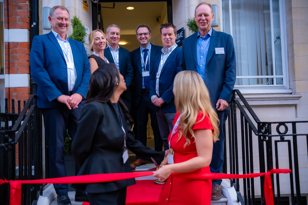 Cutting the ribbon on the steps of 45 Queen Anne Street at the relaunch