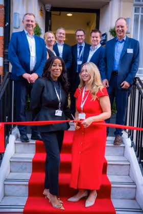 Cutting the ribbon at 45 Queen Anne Street