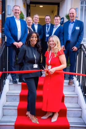 Cutting the ribbon at 45 Queen Anne Street