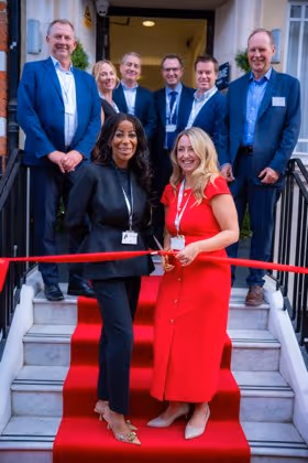 Cutting the ribbon at 45 Queen Anne Street
