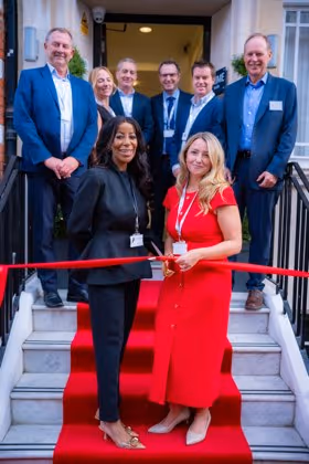 Cutting the ribbon at 45 Queen Anne Street